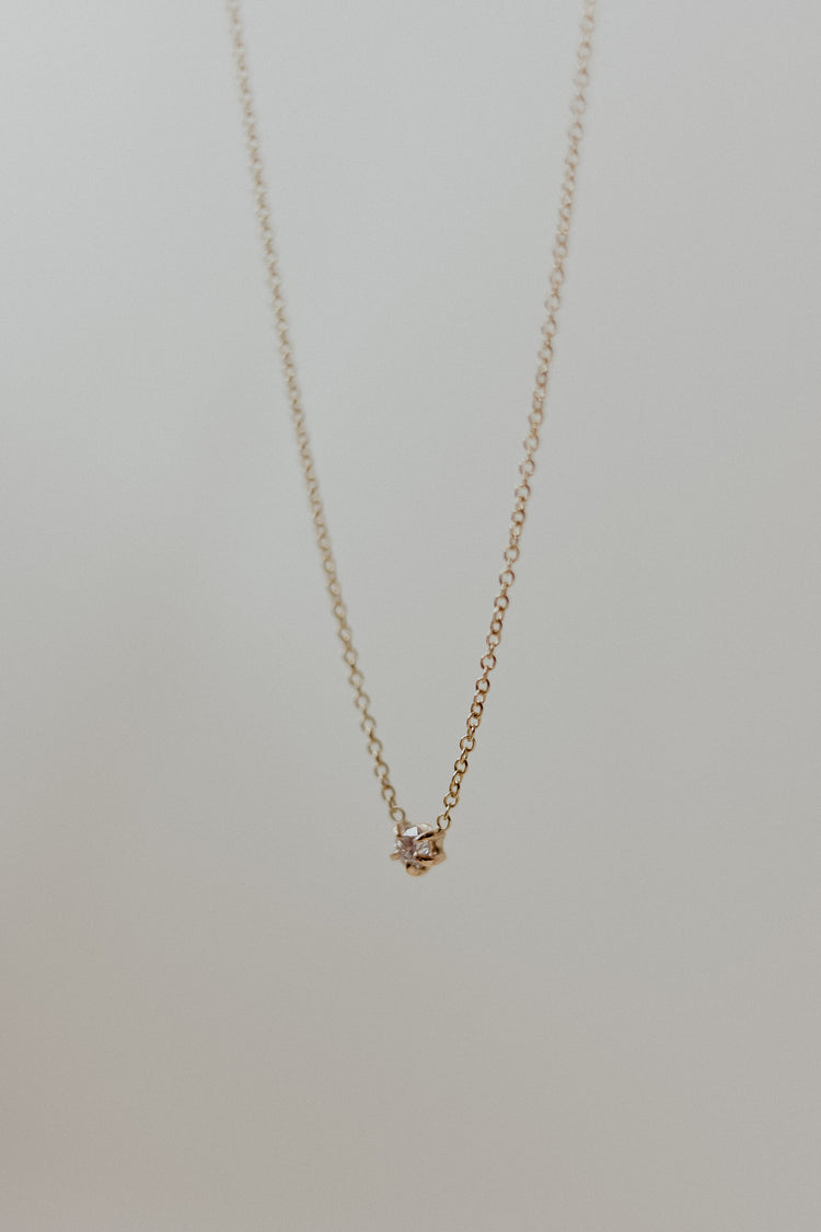 A unique recycled white diamond necklace handcrafted in 9ct gold.