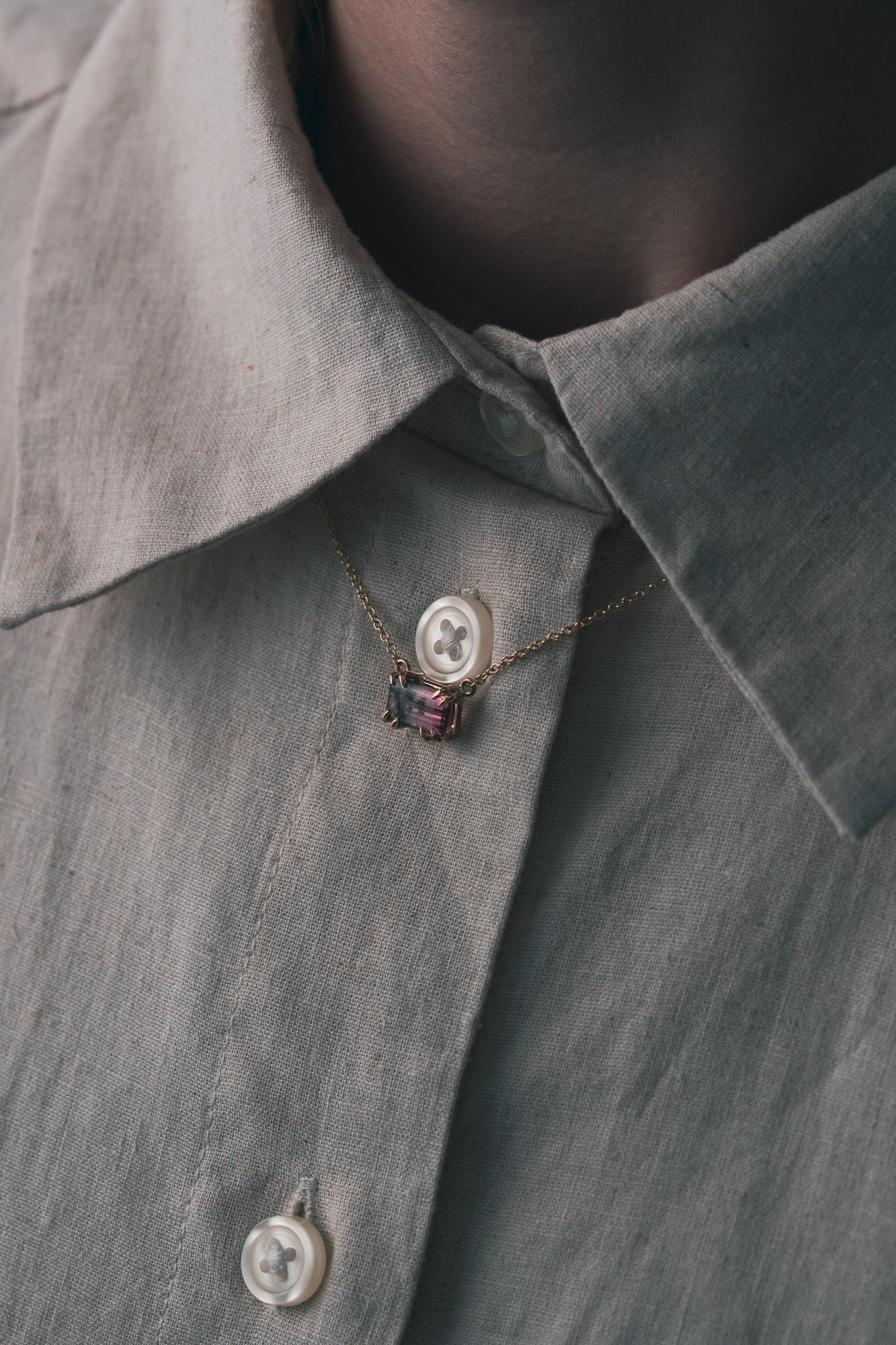 Showcase a pink bicolour natural tourmaline in recycled gold 