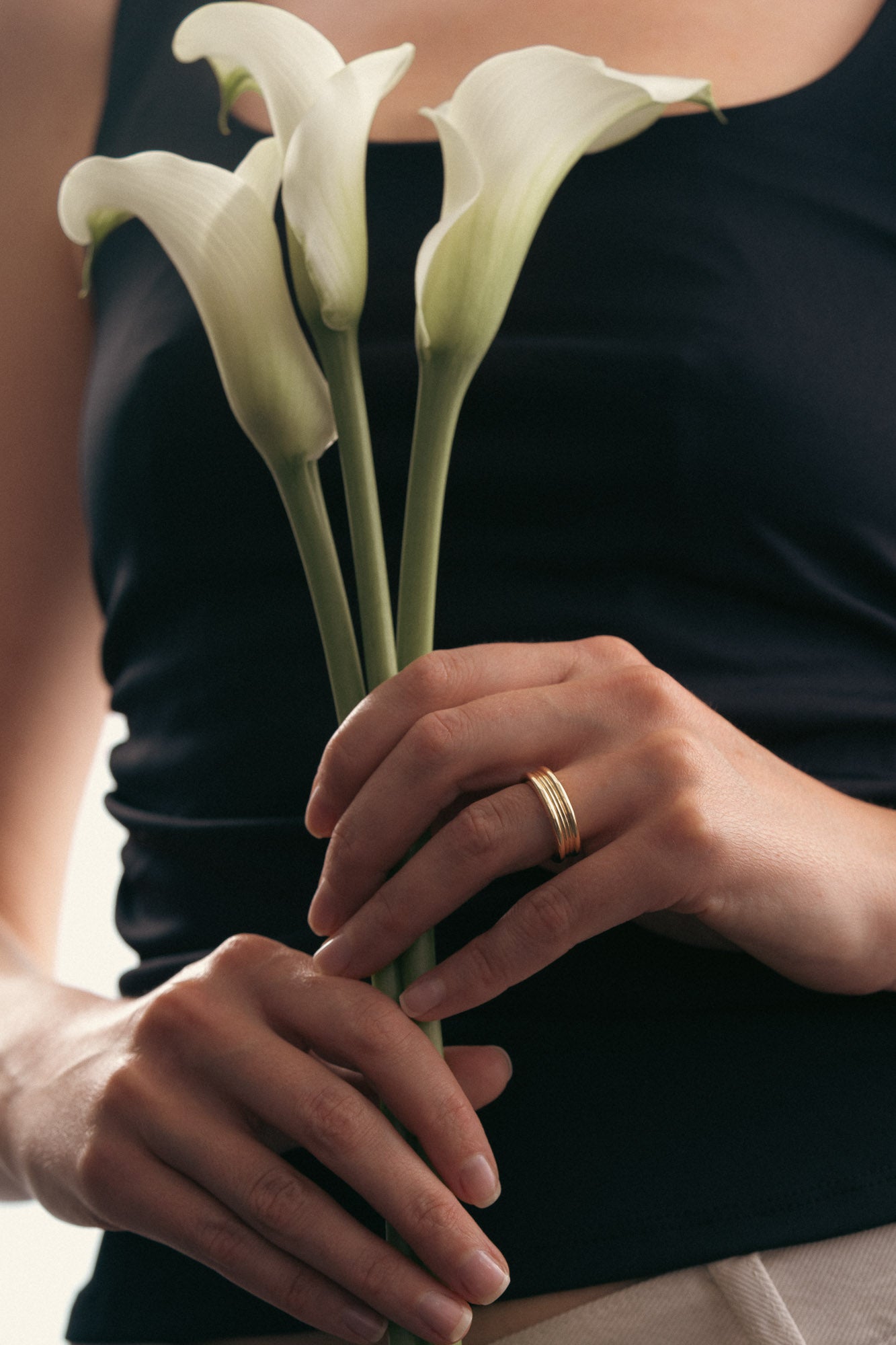 Woman wearing the stacked form I ring.