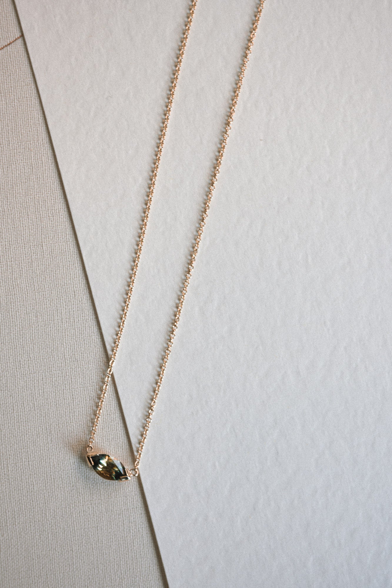 Unique bicolour sapphire necklace with green gemstone