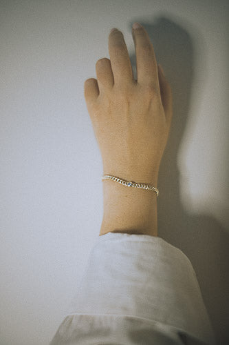 Ethical diamond bracelet in recycled gold with curb chain design.