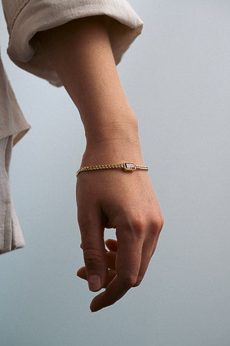  post-consumer recycled gold bracelet styling a curb chain and gemstones