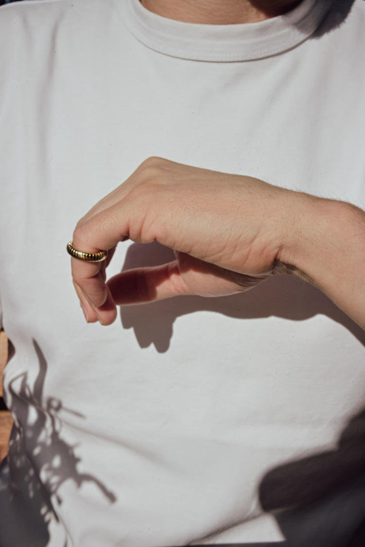 Man wearing a modern timeless wedding band. 